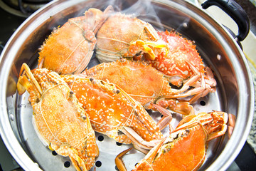 Crabs stream cooking in kitchen