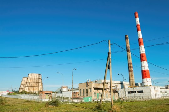 Pipes of thermal power plant against blue sky, established in Volgodonsk.
