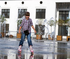 girl playing in the fountain