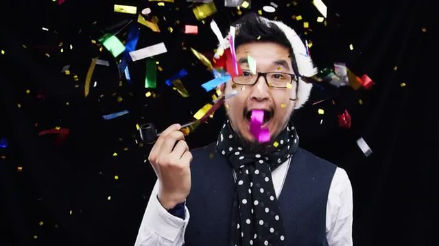 Chinese man smoking pipe in confetti shower slow motion party photo booth 