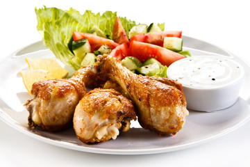 Roasted chicken drumsticks and vegetables