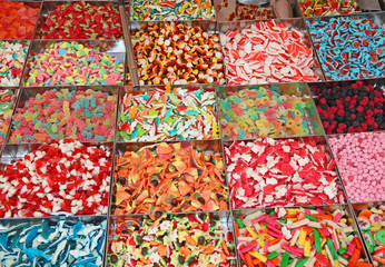 many sugary candy and chewy for sale in candy stall in the local