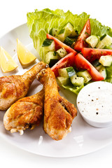 Roasted chicken drumsticks and vegetables