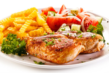 Fried chicken fillet, chips and vegetable salad 