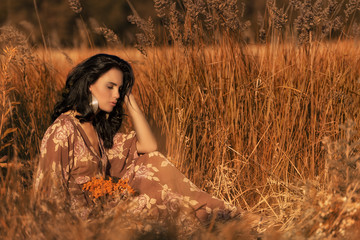 Brunette girl in summer field