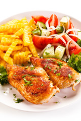 Fried chicken fillet, chips and vegetable salad 