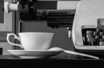 Typewriter and Coffee Cup; Black and white Photography.