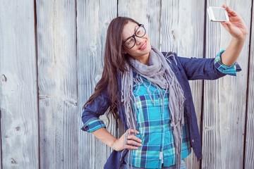 Fototapeta premium Happy hipster holding a mobile phone