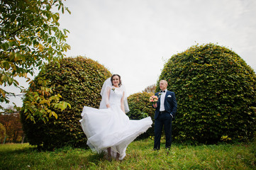 wedding couple background brushes at autumn park