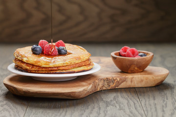 Pancakes with raspberry, blueberry and maple syrup