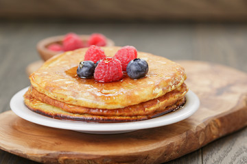 Pancakes with raspberry, blueberry and maple syrup