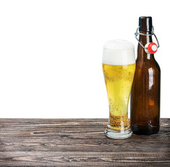 glass of beer and an empty bottle
