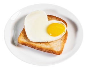 heart-shaped fried eggs and fried toast isolated