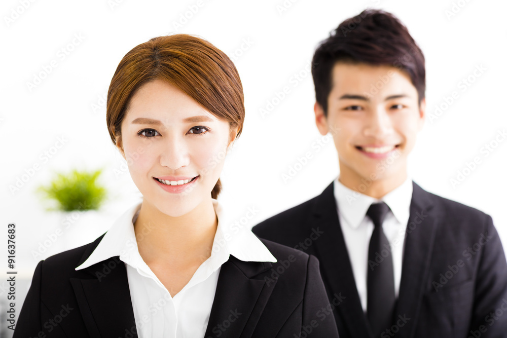 Wall mural happy business man and woman standing in office