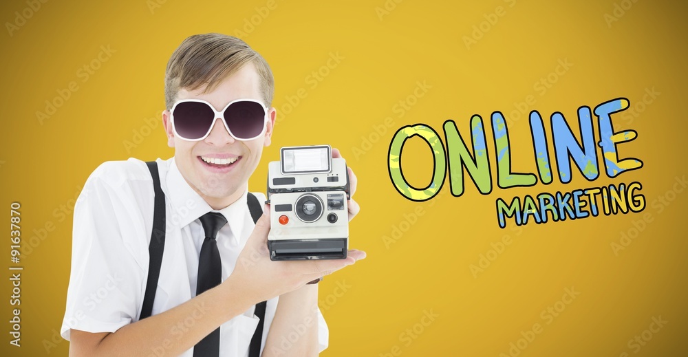 Poster composite image of geeky hipster holding a retro camera