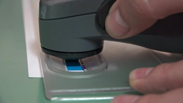 4K Print Spectrophotometer on Chart, creation of color profile, closeup. UHD stock footage