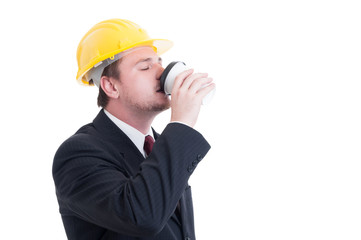 Contractor, engineer or architect drinking coffee to go