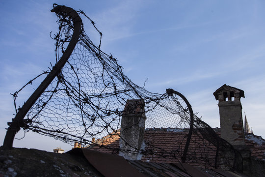 barbed wire on prison brick wall 
