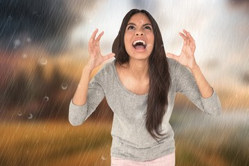 Composite image of angry brunette shouting