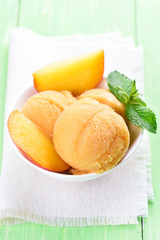 Peach sorbet with fresh fruit slices