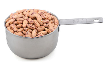 Borlotti beans in a measuring cup