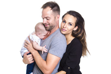 Happy young couple holding a 3 months old baby