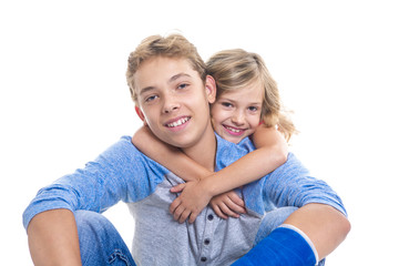 beautiful children teenager boy with is young sister