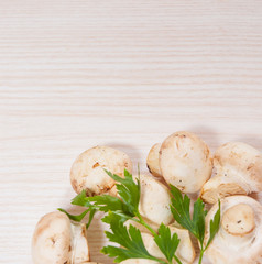 Food background of fresh mushrooms at the wooden board with copy space