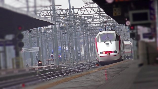 Fast train departs from station platform. 4k UHD stock footage