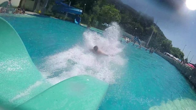 Guy Sliding Down a Open Water Slide Tube, SUPER SLOW MOTION