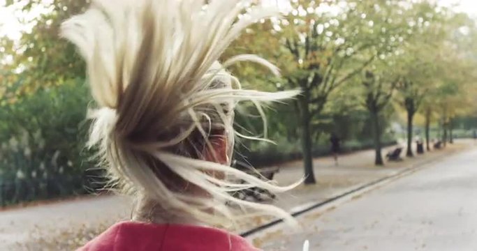 woman running pony tail Close up behind shot