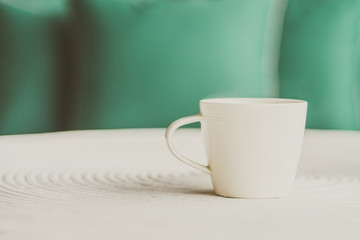 Selective focus point on black coffee in white cup - vintage fil