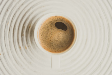 Fototapeta na wymiar Selective focus point on black coffee in white cup - vintage fil
