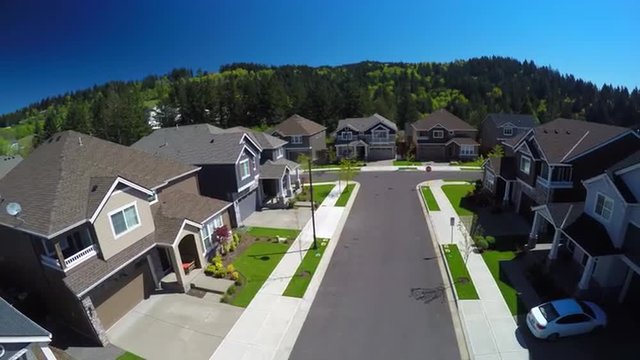 An aerial image over a typical american suburban street.