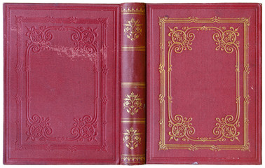 Old open book cover in red canvas with embossed golden abstract decorations (circa 1885), isolated on white