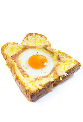 Cooked egg on bread with bacon isolated on white background