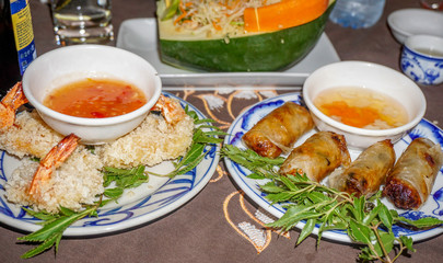 Vietnamese meal with nem and deep fried prawn beignet dishes