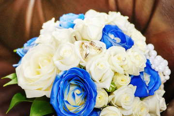 Wedding bouquet and rings.