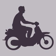 Fototapeta na wymiar Vector Silhouette of Man on Motorbike