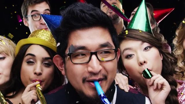 Multi-ethnic group of people celebrating birthday party slow motion photo booth 