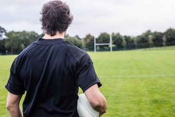 Fototapeta premium Rugby player looking at posts