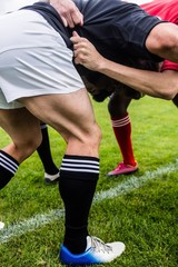 Fototapeta premium Rugby players doing a scrum
