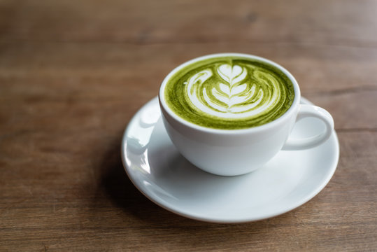 matcha latte on wooden background