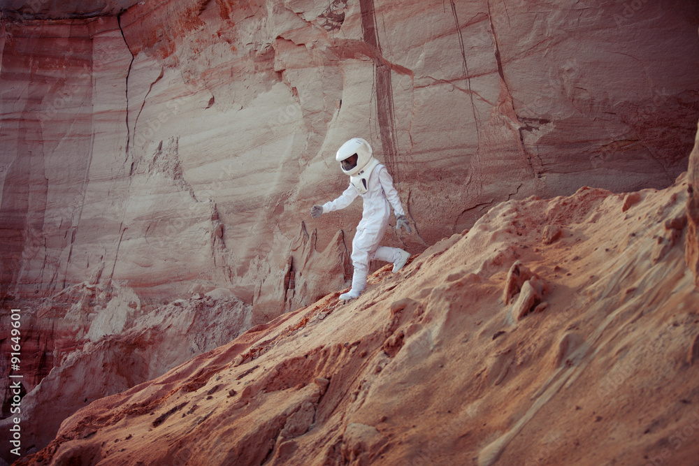 Wall mural futuristic astronaut on another planet, image with the effect of