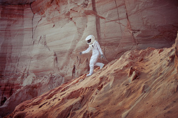 Naklejka premium futuristic astronaut on another planet, image with the effect of