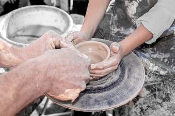 hand of the potter and the child in the creation of new products