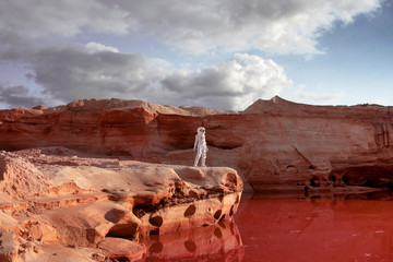 Fototapeta premium futuristic astronaut on another planet, image with the effect of