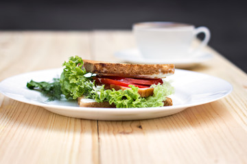 Healthy ham sandwich with cheese, tomatoes and lettuce