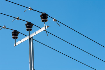 coil of high voltage cables against the blue sky