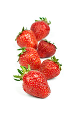 strawberry lies in one row, isolated